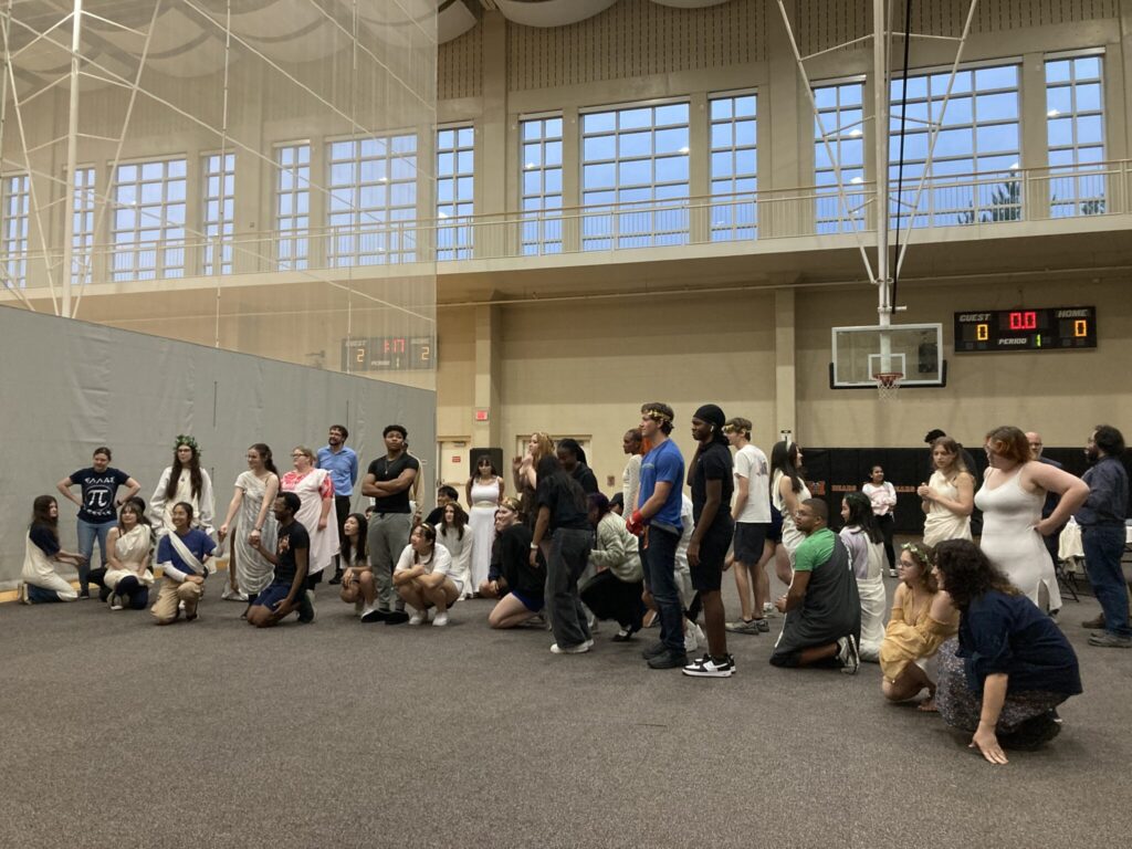Students standing and kneeling.